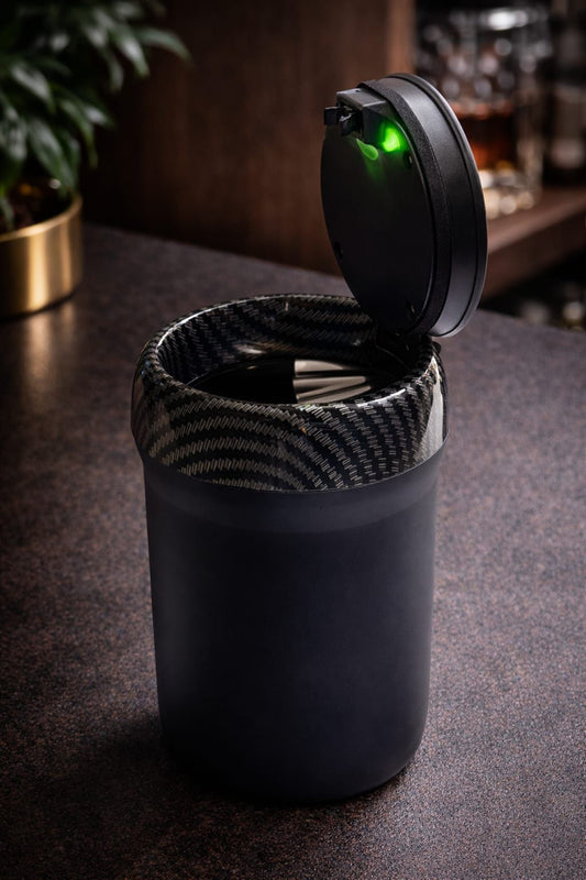 Matte black LED flip-top ashtray with carbon fibre inner rim