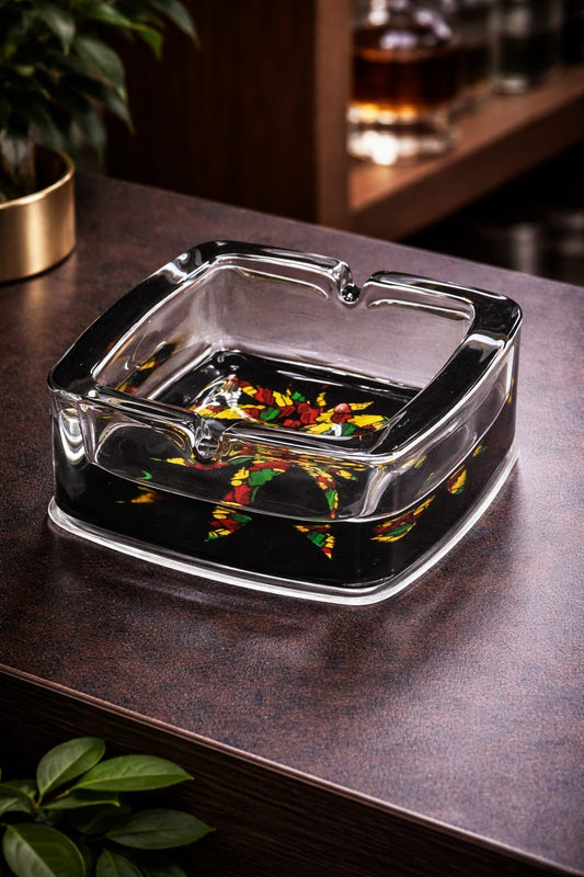 Black art glass ashtray with vibrant floral mosaic design