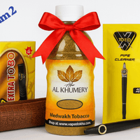 Al Khumery tobacco bottle with a red bow, Extar Torbo packaging, and a pipe cleaner on a white background. Vape Dokha UAE