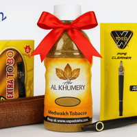 Al Khumery tobacco bottle with a red bow, Extra XToro packaging, and a pipe cleaner on a white background. Vape dokha UAE