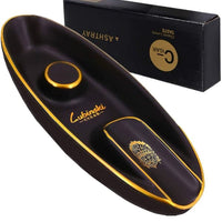 Black and gold cigar humidor with Lubincki branding on a white background.Vape Dokha UAE