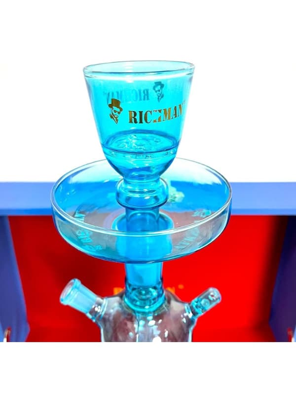 Blue glass Richman hookah with 'RICHMAN' branding on a red and blue background .Vape Dokha UAE