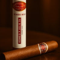 Cigar and Romeo y Julieta vape dokha bottle on a dark surface .Vape Dokha UAE