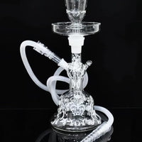 Clear glass hookah with white hose on a black background . Vape Dokha UAE