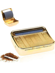 Gold cigarette case with rolling machine and tobacco on a white background.vape dokha uae