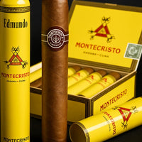 Montecristo cigars with yellow tubes and box on a dark background. Vape Dokha UAE