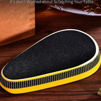 Non-slip mat with black surface and yellow border on a wooden surface.Vape Dokha UAE