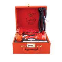 Orange briefcase  fro alfakher hookha set with glassware and a bottle inside on a white background . Vape Dokha UAE
