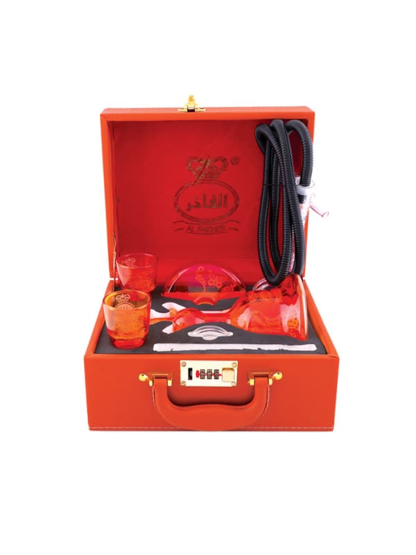 Orange briefcase  fro alfakher hookha set with glassware and a bottle inside on a white background . Vape Dokha UAE