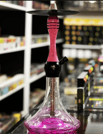 Pink and black hookah with a blurred store shelf in the background. Vape Dokha UAE