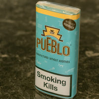 Pueblo cigarettes packaging on a textured surface | Vape Dokha UAE