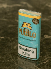 Pueblo cigarettes packaging on a textured surface | Vape Dokha UAE