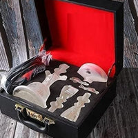 Set of white Alfakher Hookha  tools in a black suitcase with red interior on a wooden surface . Vape Dokha UAE