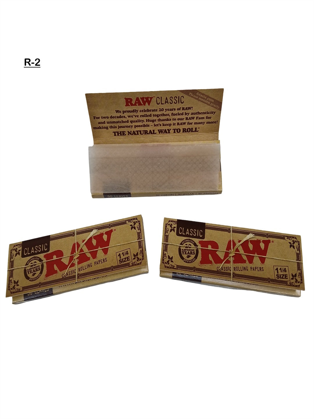 Three packs of Raw classic rolling papers on a white background \Vape dokha UAE