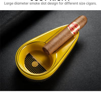 Yellow cigar ashtray with a cigar on a dark background.Vape Dokha UAE