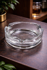 Heavy ribbed round glass ashtray with 4 rests